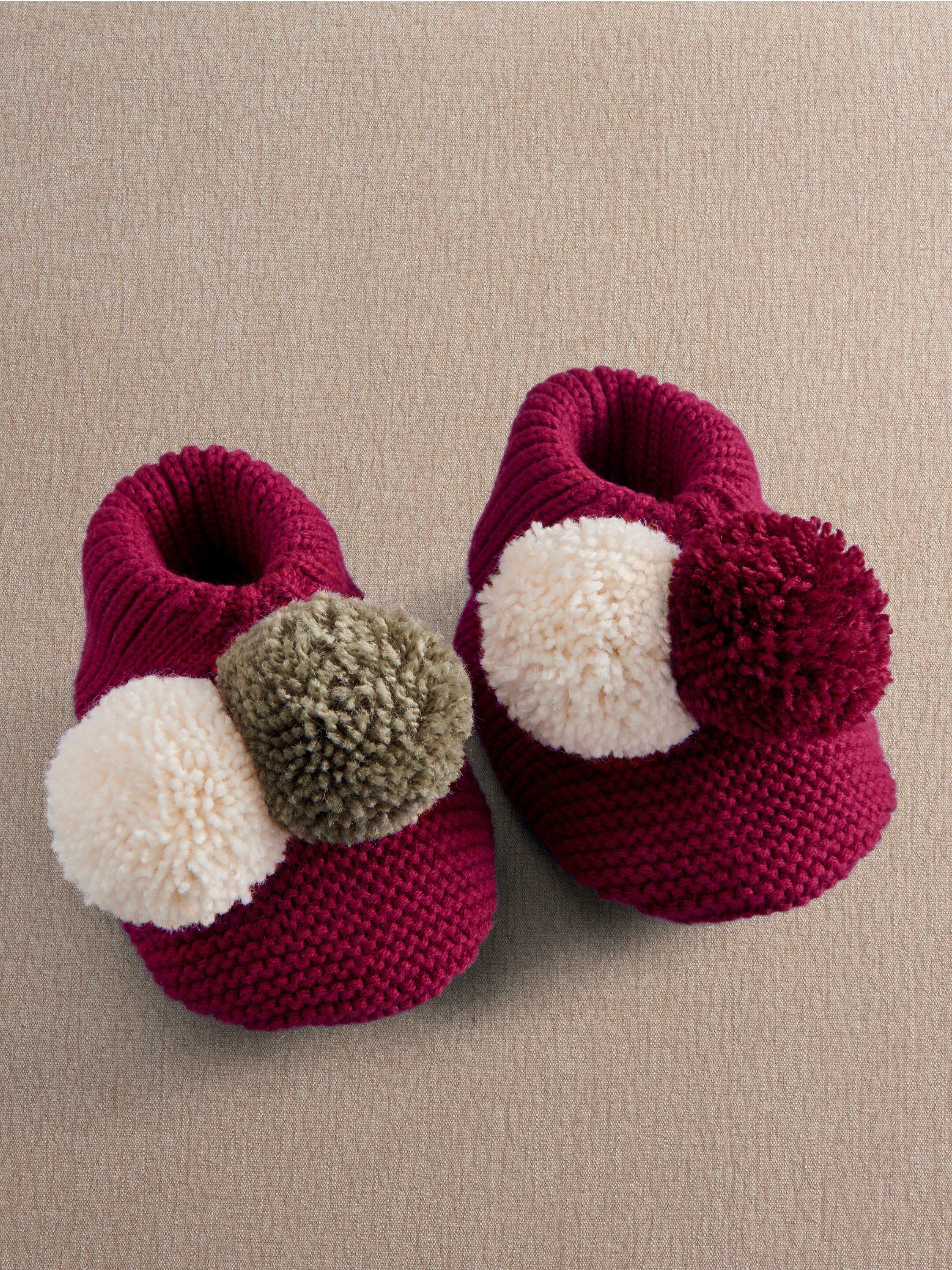 Knitted Pom Pom Booties image number 1